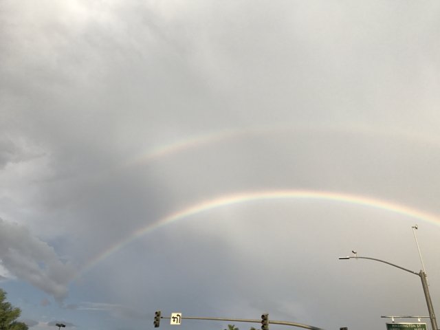 Double Rainbow Over City Street