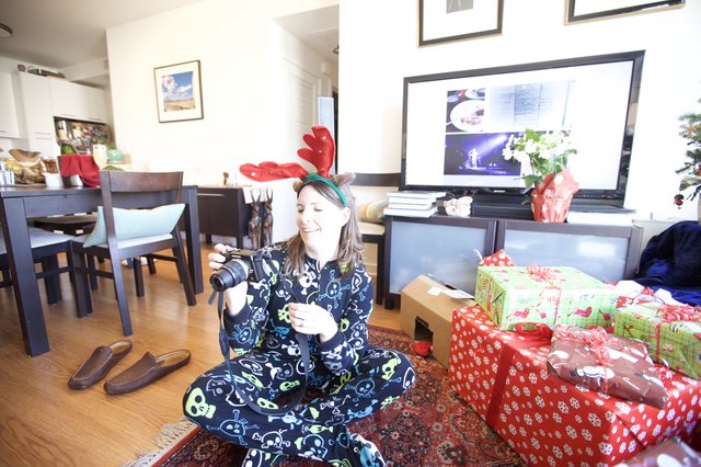 Christmas Morning Joy with Camera and Reindeer Antlers