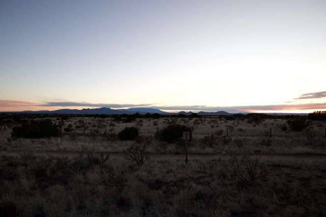Desert Twilight Over Distant Mountain Ranges