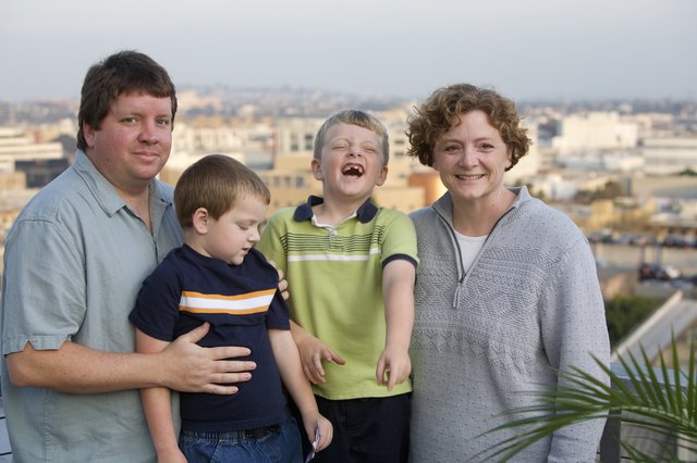 Family Portrait on Urban Rooftop at Dusk