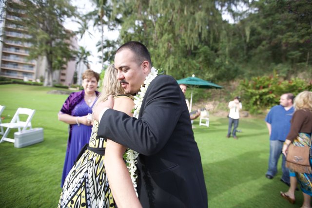A Loving Embrace at a Hawaiian Wedding