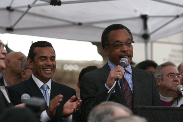 Two Men in Suits and Ties with Microphones