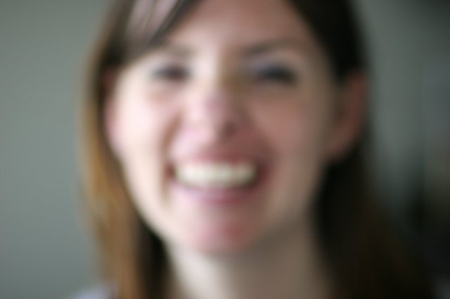 Blurred Portrait of a Smiling Young Woman