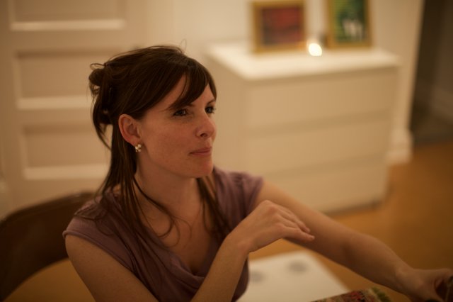 Contemplative Woman at Art Gallery Evening Event