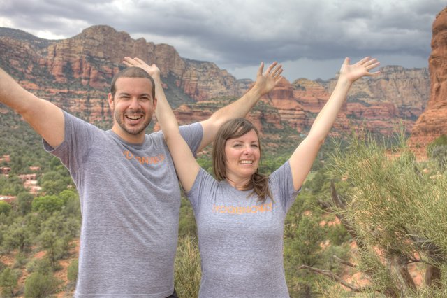 Joyful Couple Celebrating Atop Sedona Red Rocks