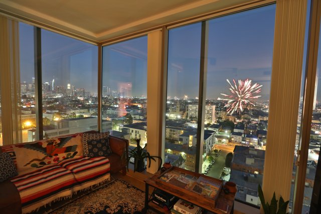 City Lights and Fireworks from a Penthouse Living Room