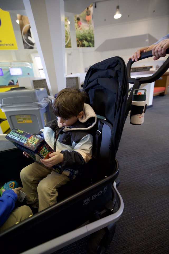 Young Reader in Stroller at Modern Museum