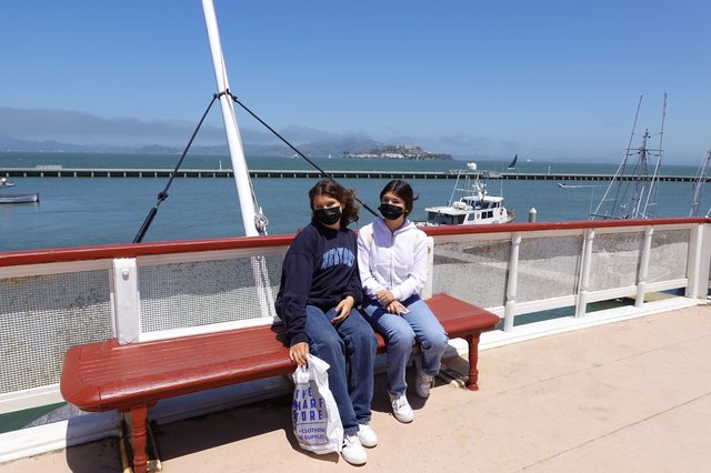 Two Friends Enjoying Bay Views from Ferry Deck