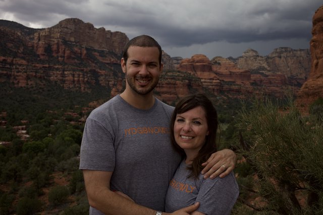 Couple Smiling Against Sedona Red Rock Backdrop