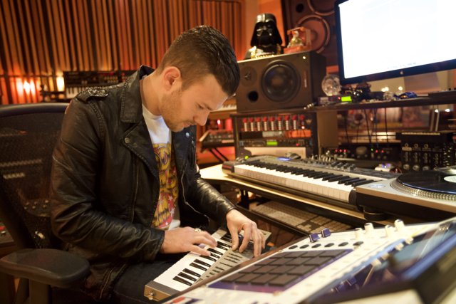 Leather Jacketed Musician Playing Electronic Keyboard