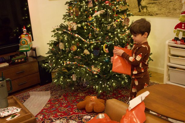 Child Opening Presents on Christmas Morning