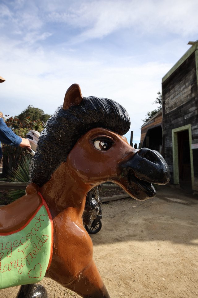 Close-Up of Whimsical Carousel Horse in Rustic Setting