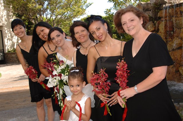 Bridal Party Poses Outdoors in Black Dresses