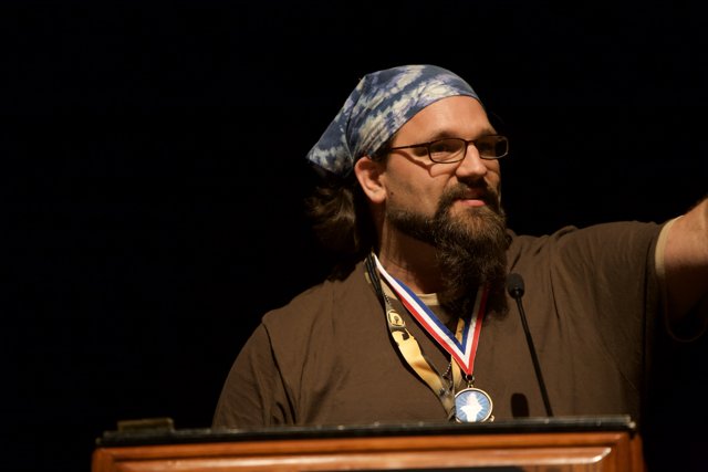 Medal-Winning Bearded Man
