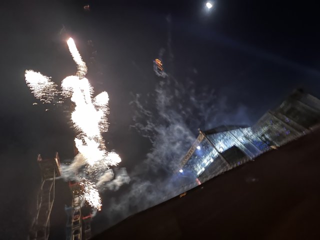 Explosions of Fireworks Illuminate the Night Sky