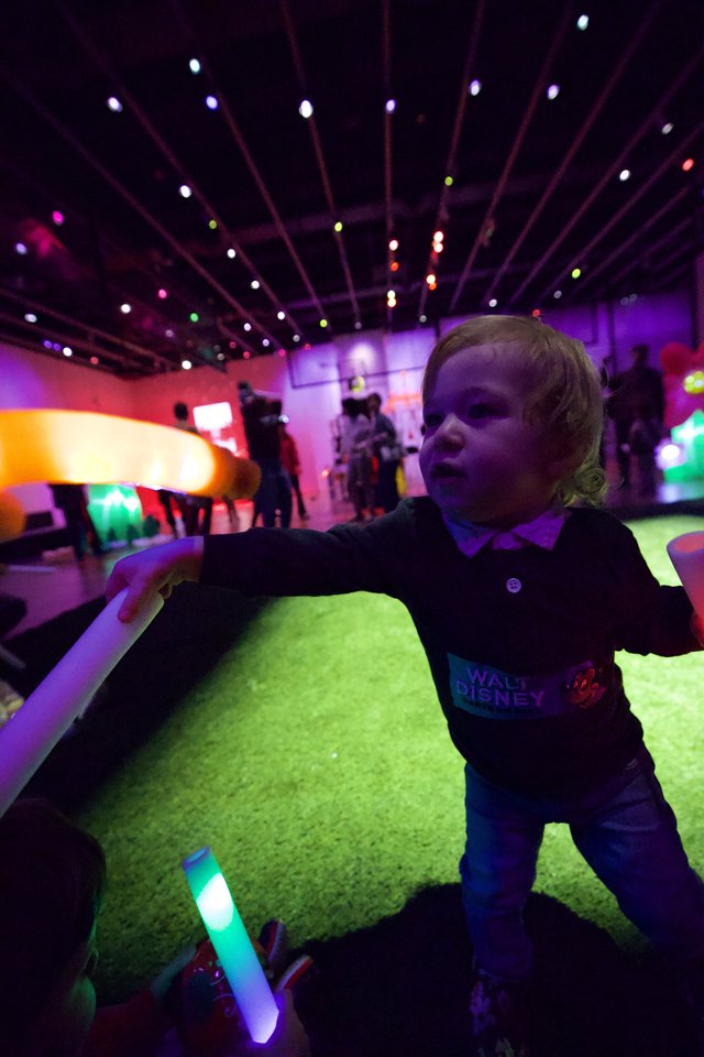 Child Experiencing Immersive Light Installation at Baby Rave