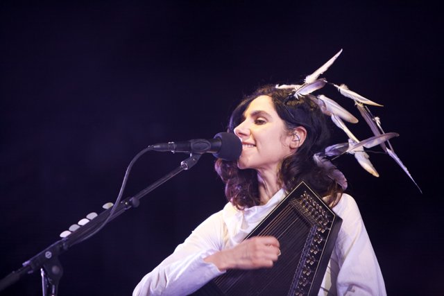 Feathers and Music: PJ Harvey's Electrifying Solo Performance
