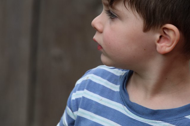 Young Boy in Striped Shirt Profile Portrait