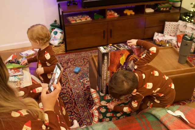 Christmas Morning Gift Opening in Matching Pajamas