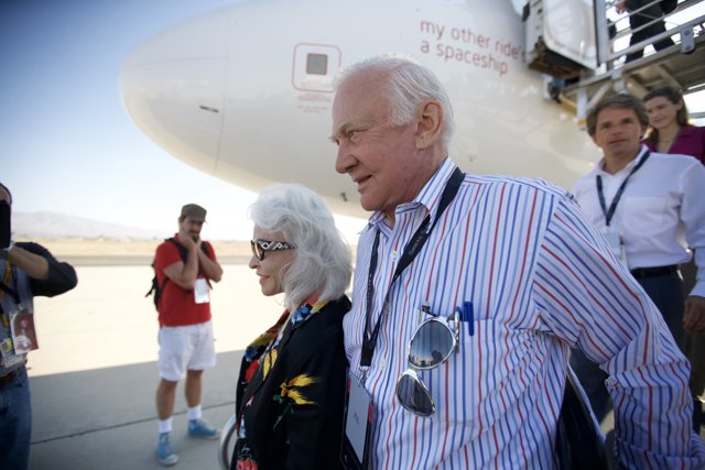 Buzz Aldrin with fans at an airfield