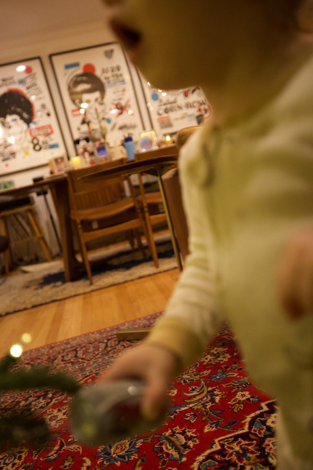 Child Playing on Colorful Oriental Rug in Cozy Room