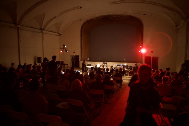 Red-Lit Audience in Theater