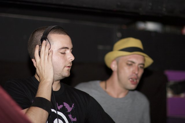 Two Men Jamming with Headphones