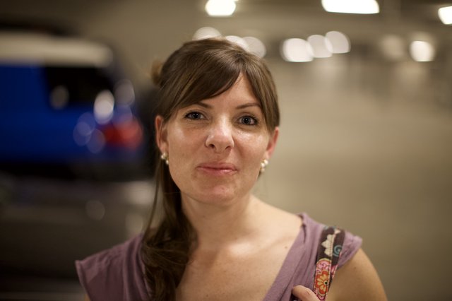 Woman in Parking Garage with Warm Evening Light