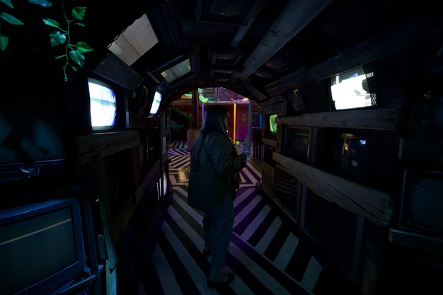 Third-Person Gaming in a Darkened Treehouse Interior