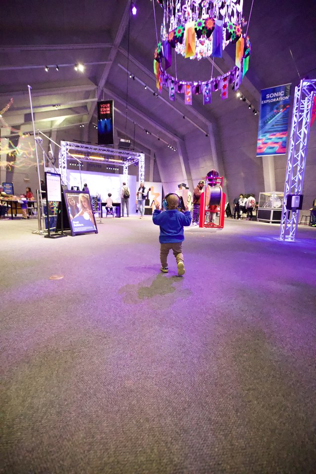 Child Explores Interactive Museum Exhibition Space