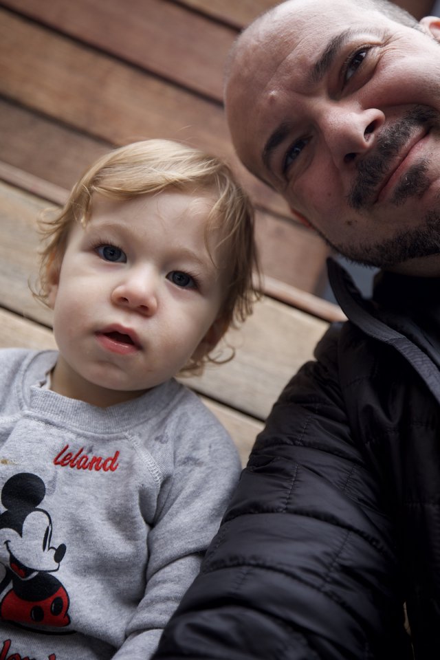 Father and Toddler Selfie on Wooden Deck