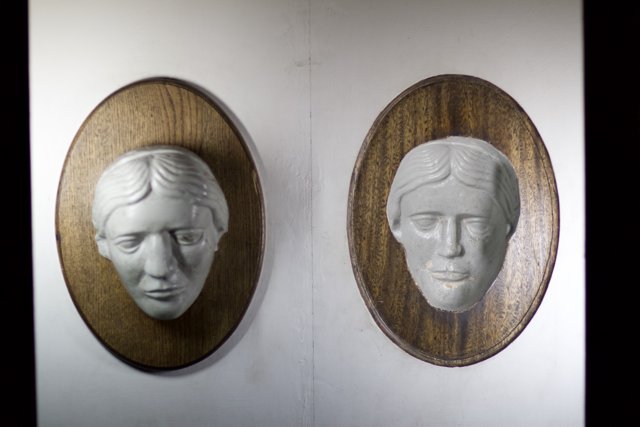 Illuminated Faces on Wooden Frames