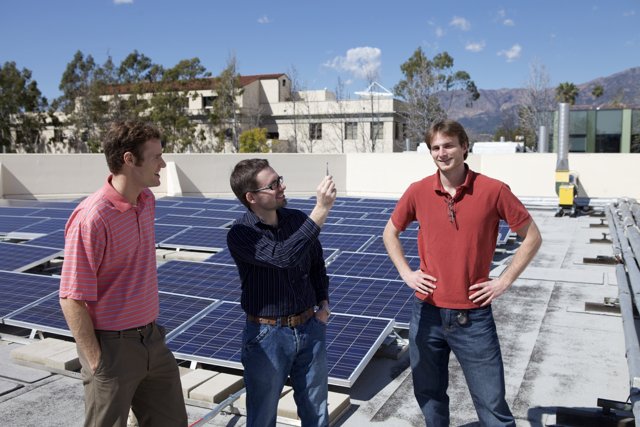 Men at Work: Installing Solar Panels on a Rooftop