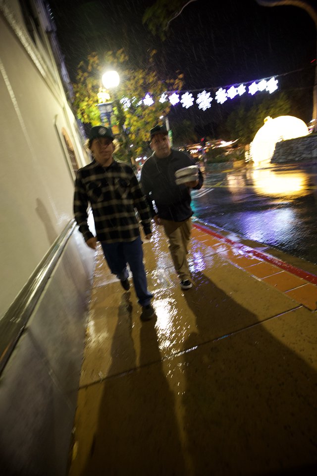 Rainy Night Walk on Illuminated Downtown Street