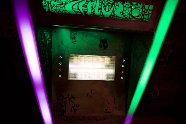 Retro Arcade Cabinet with Glowing Neon Lights