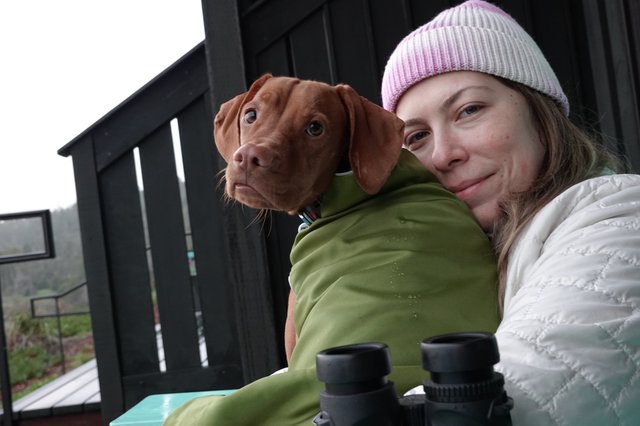 Woman and Dog Share Cozy Outdoor Moment