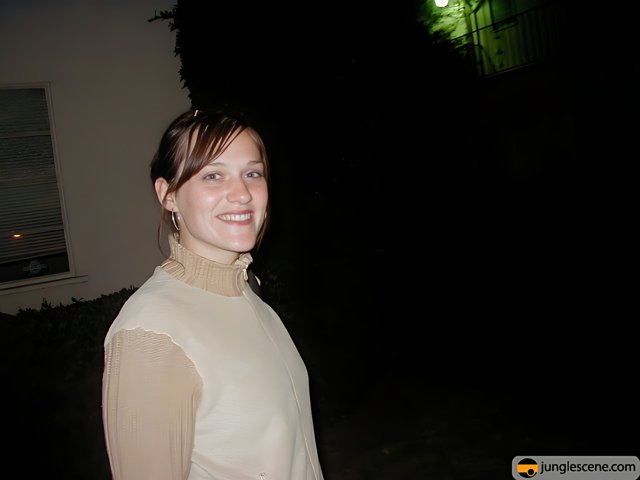 Nighttime Portrait of a Smiling Woman