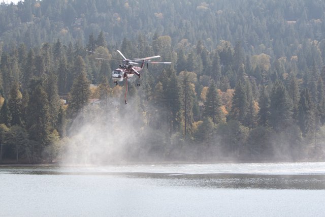Helicopter Rescue with a Fire Truck in Sight at the Lake