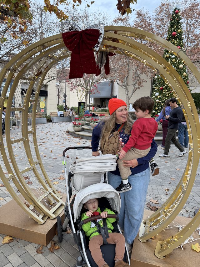 Family Holiday Moment Through Decorative Archway