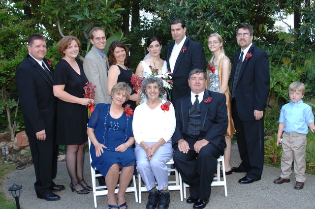 Family Wedding Portrait in Lush Garden Setting