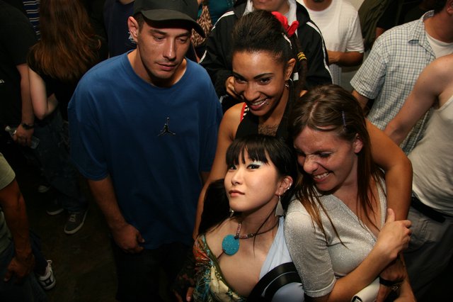 Friends Posing Together at Late Night Party Event
