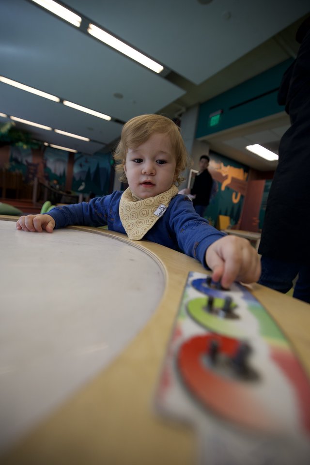 Toddler Engaged in Learning Activity at Children's Museum