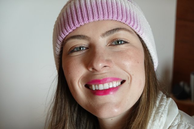Woman with Pink Beanie Bright Smile Portrait