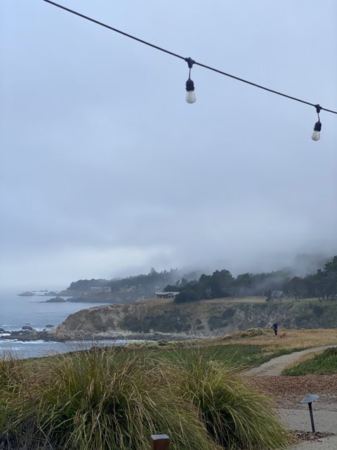 A Foggy Ocean Day by the Lighthouse