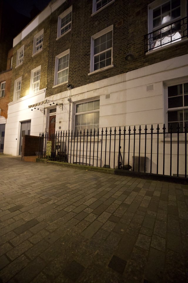 Victorian Townhouse at Night with Iron Railings