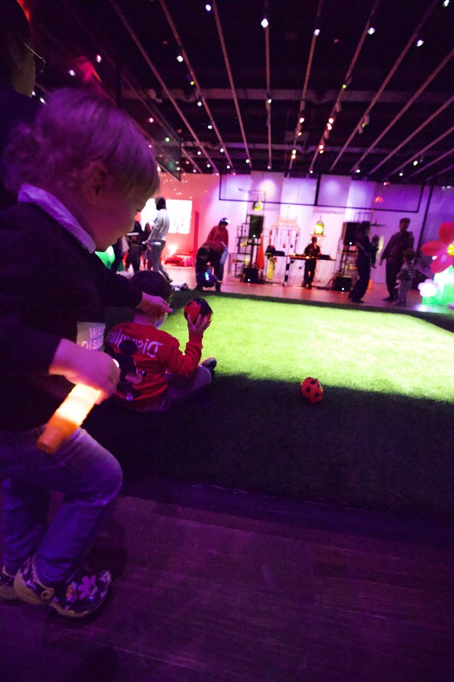 Children Playing at Baby Rave Event with Neon Lighting