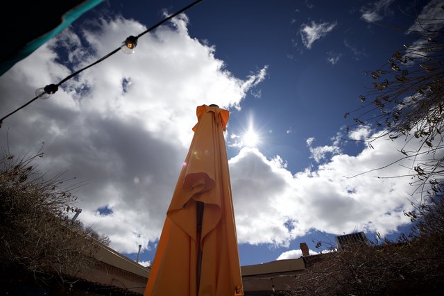 Orange Tower Monument Under Dramatic Desert Sky
