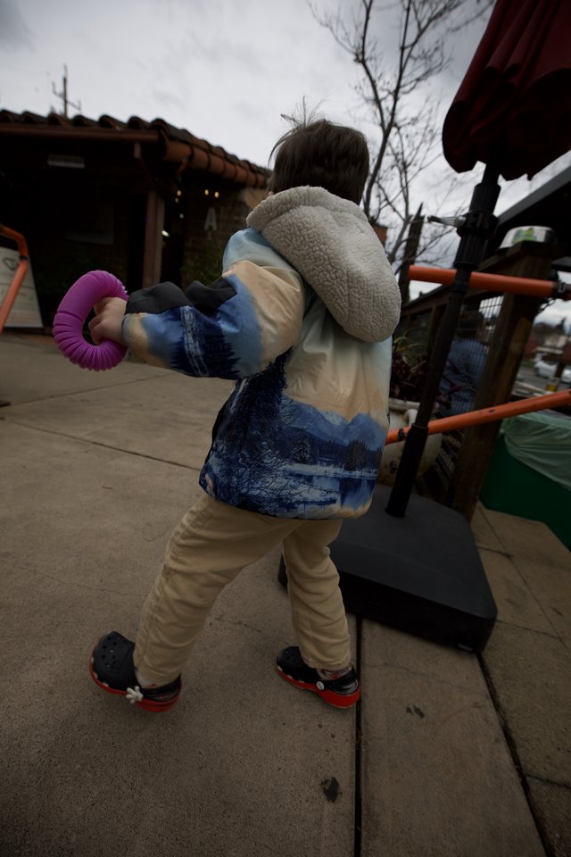 Child Playing on Outdoor Playground Equipment