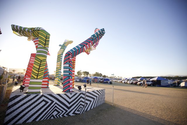 Colorful Sculpture Stands Tall in Open Field