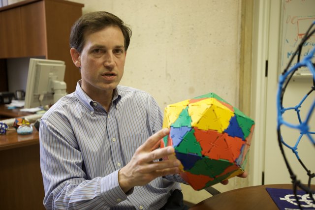 Colorful Sphere in the Hands of a Modern Man